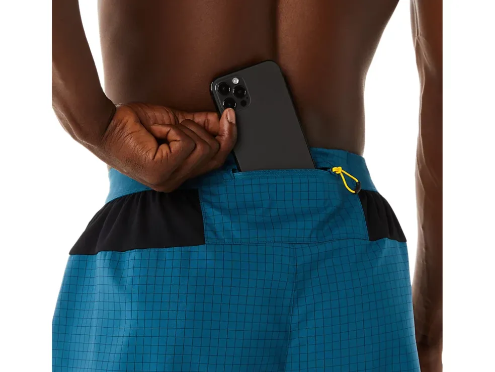 Shop ASICS MEN FUJITRAIL LOGO SHORT Ink Teal/Golden Yellow